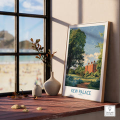 Framed Kew Palace travel poster on windowsill with vases and outdoor view