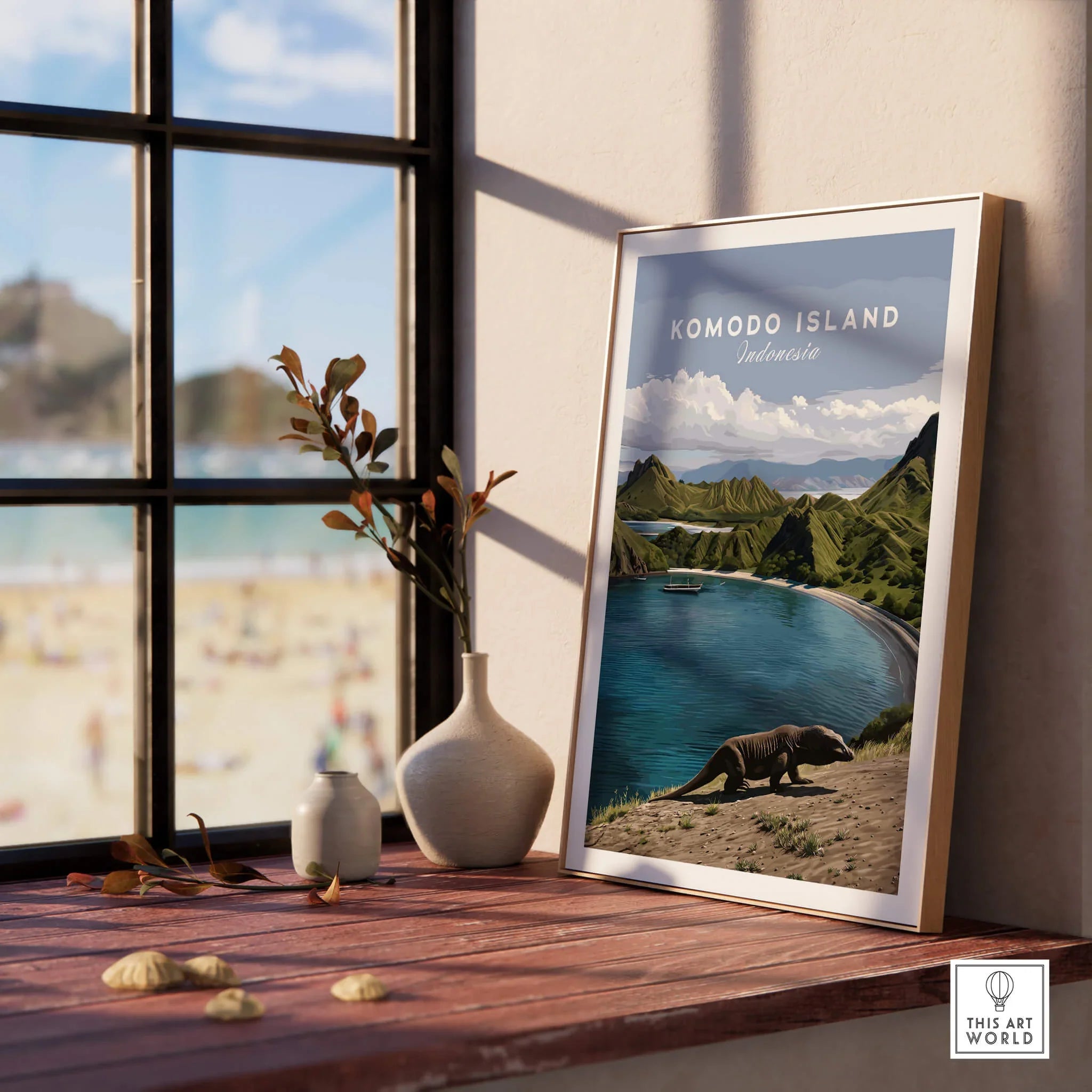 Framed Komodo Island travel poster on windowsill with vases, beach view outside window