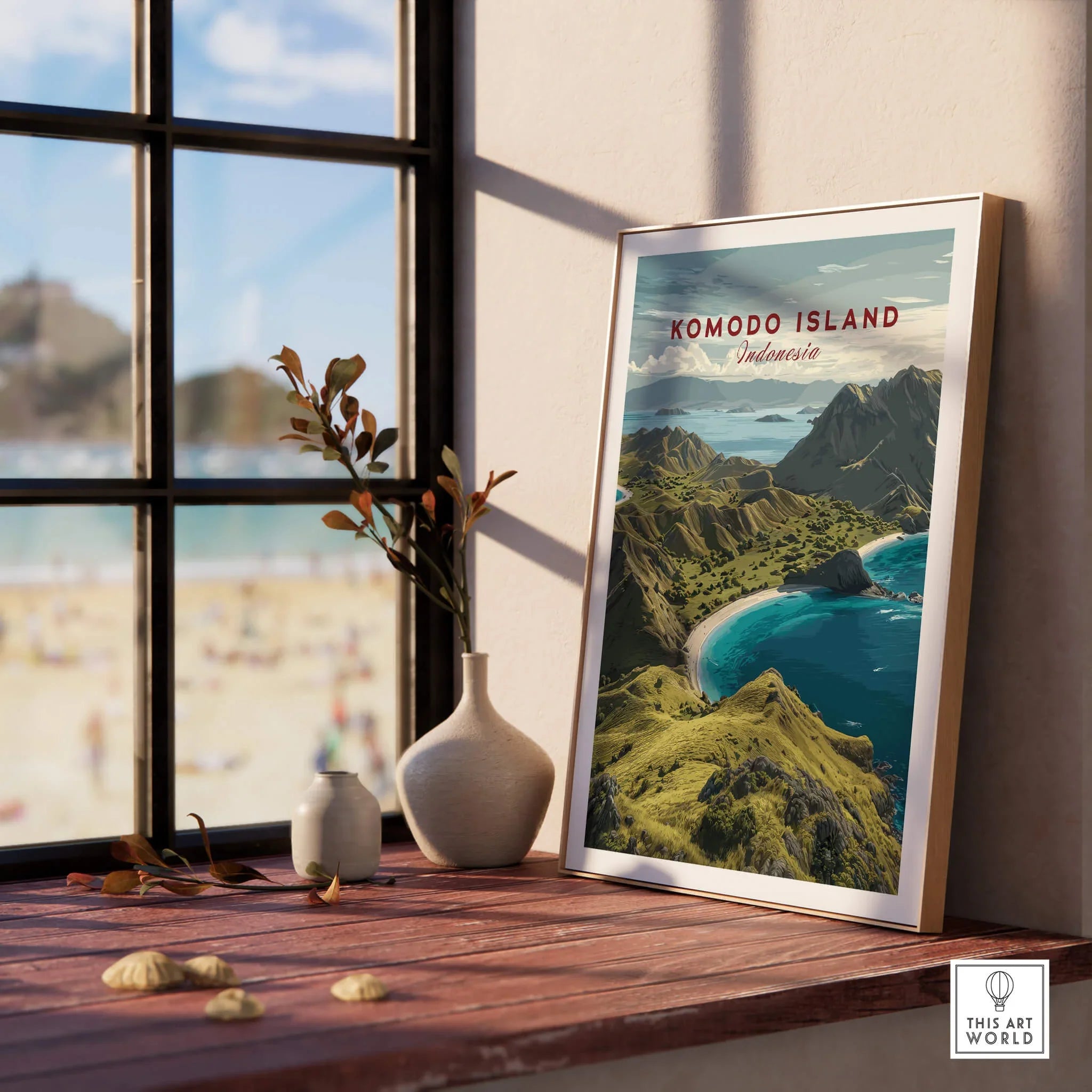 Framed Komodo Island travel poster on wooden windowsill with vases and beach view