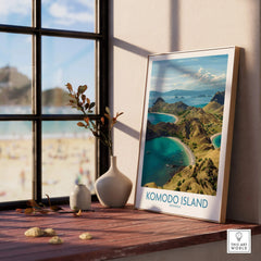 Framed Komodo Island travel poster on windowsill with beach scene and minimalist vases