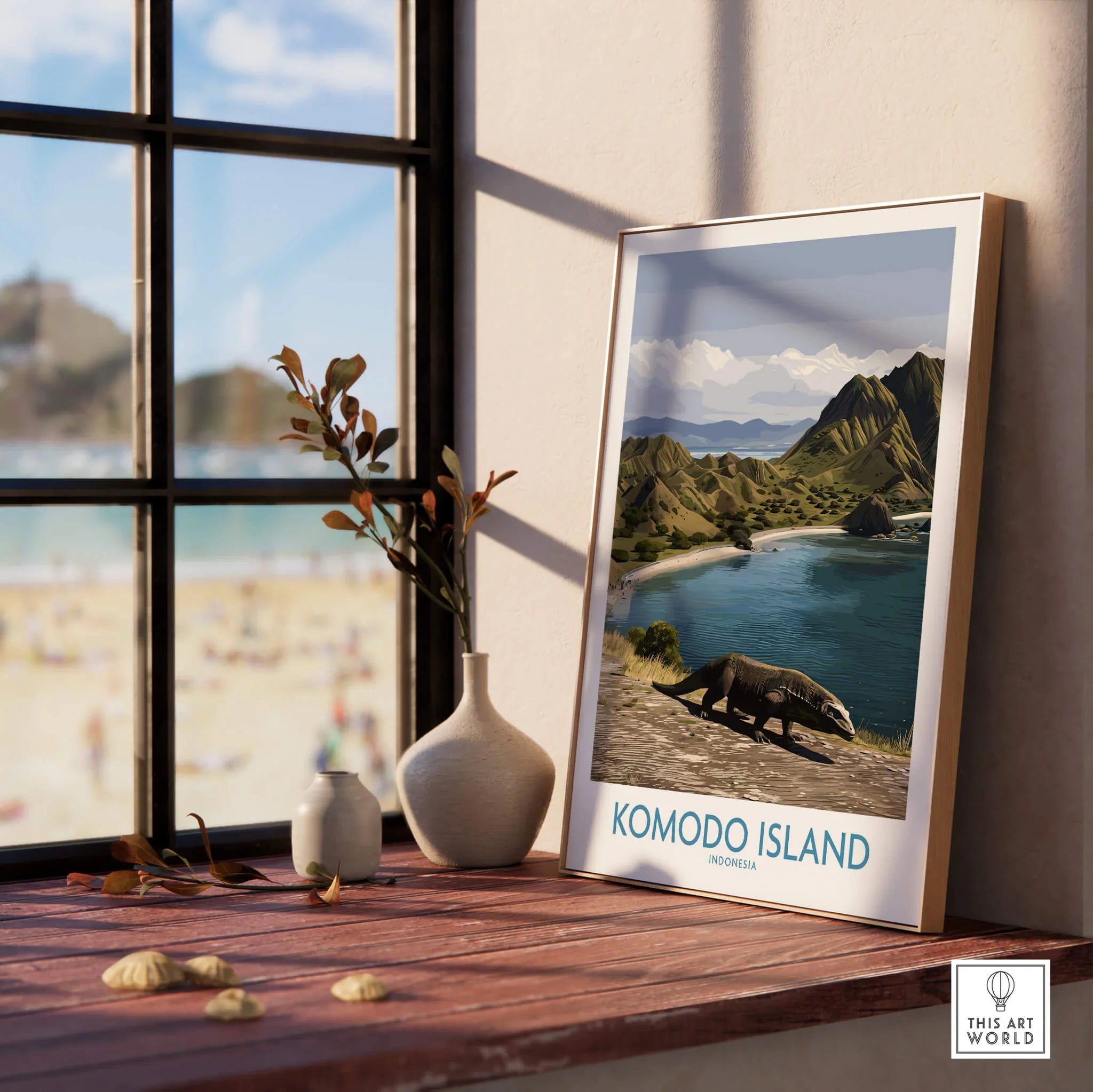 Framed Komodo Island travel poster on windowsill, natural wood frame, beach view, modern decor
