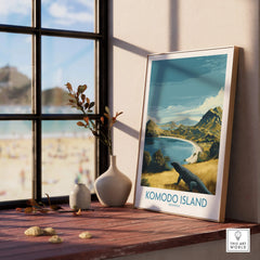 Framed Komodo Island travel poster on windowsill with coastal landscape and vase decor.