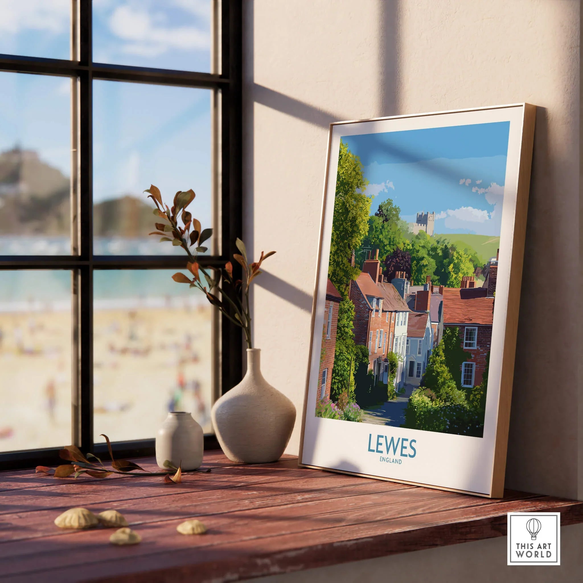 Framed Lewes travel poster with natural wood frame on a windowsill, home decor style