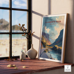 Framed Llanberis Pass travel poster on windowsill with vases, mountains and river art print