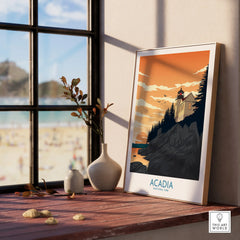 Acadia National Park print with lighthouse in natural wood frame on windowsill, beach view outside.