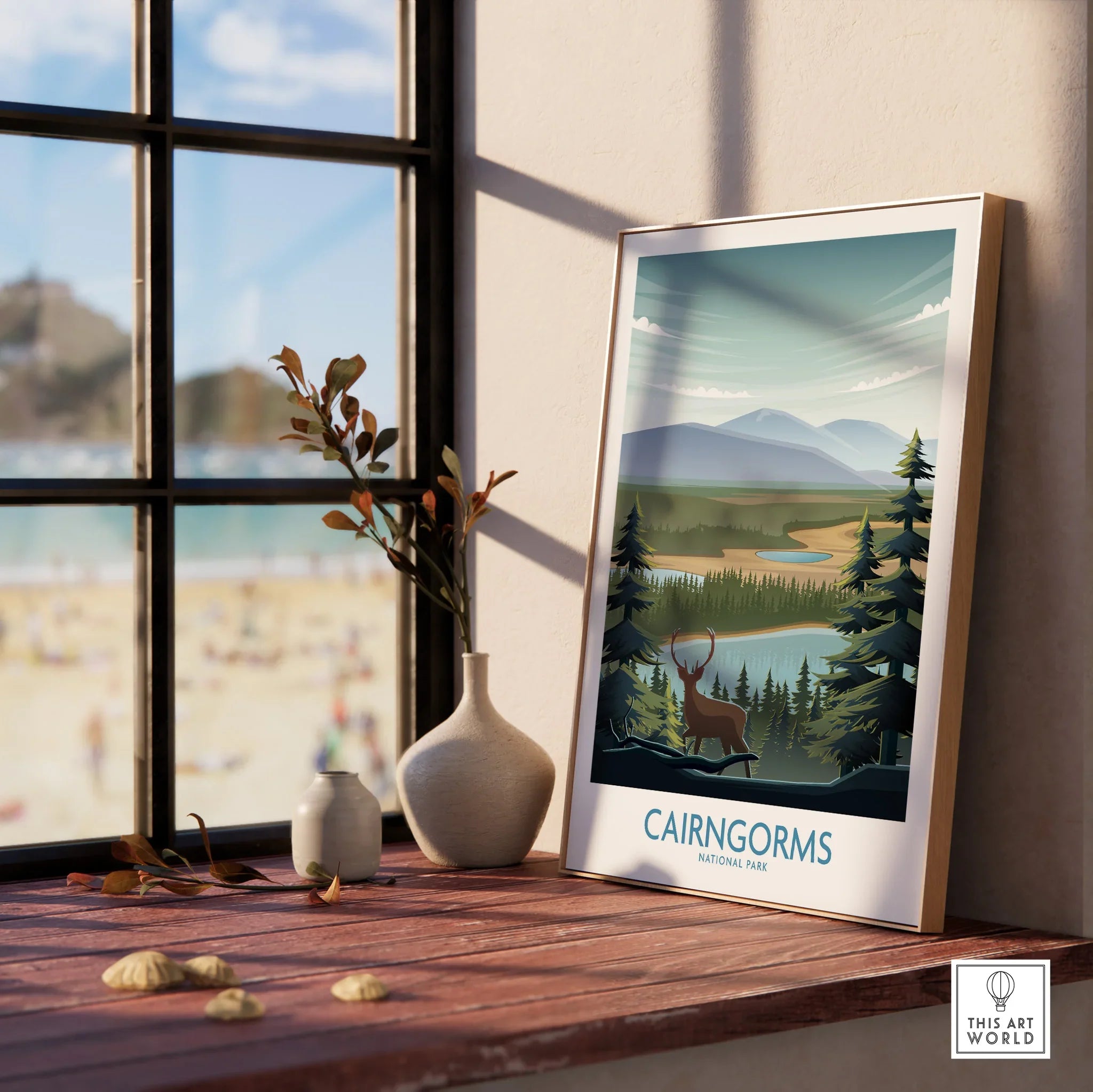 Cairngorms National Park framed art print on a window sill with vases and beach view