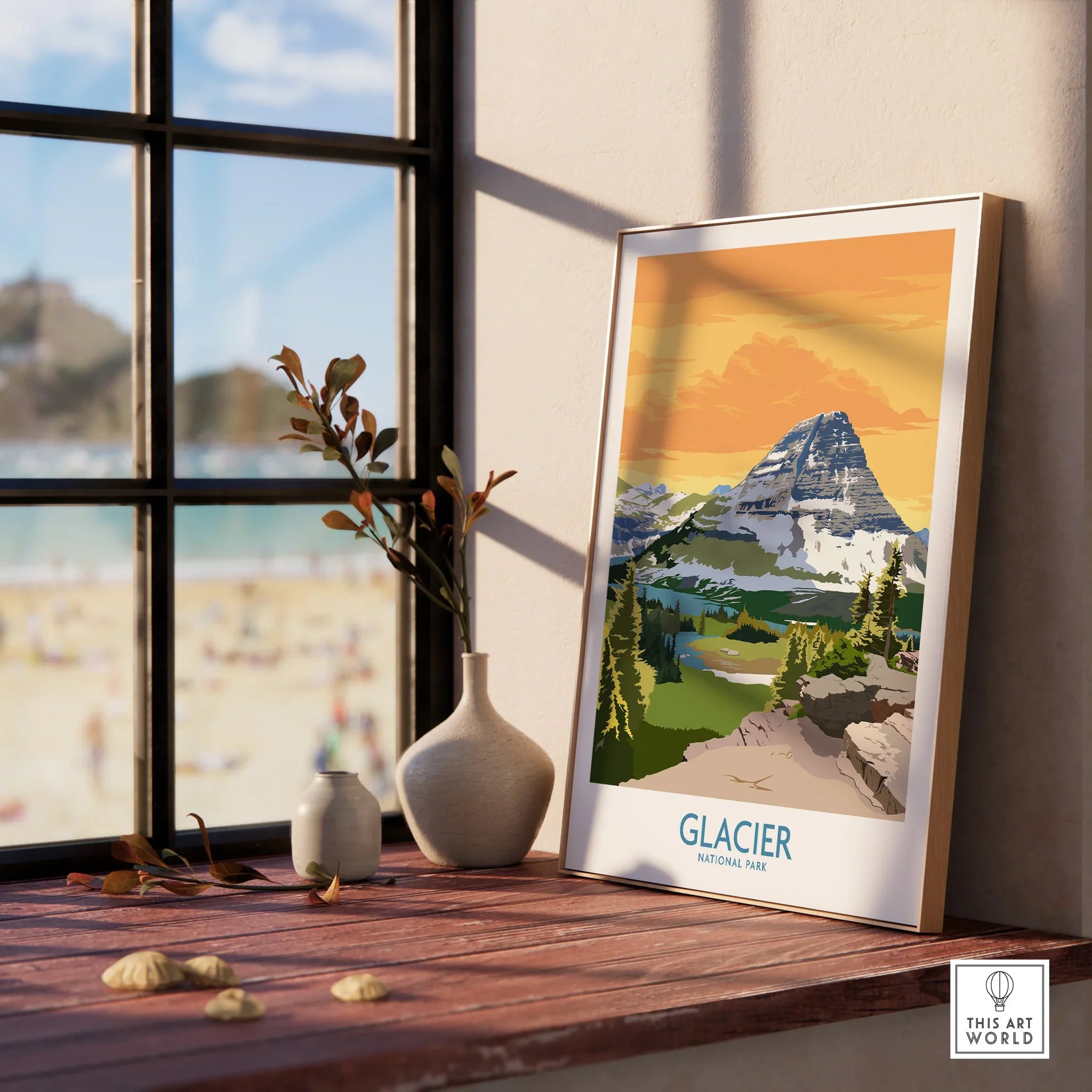 Framed Glacier National Park print on a windowsill with vases and beach view outside.