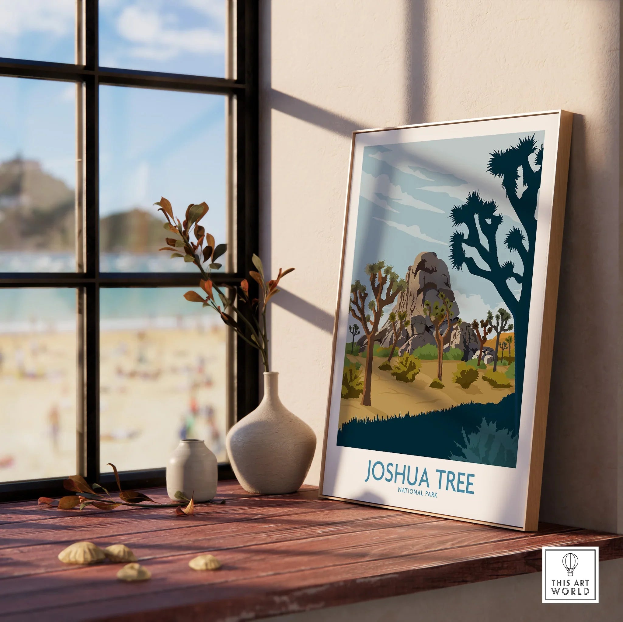 Joshua Tree National Park framed wall art print on a windowsill with vases, beach view outside