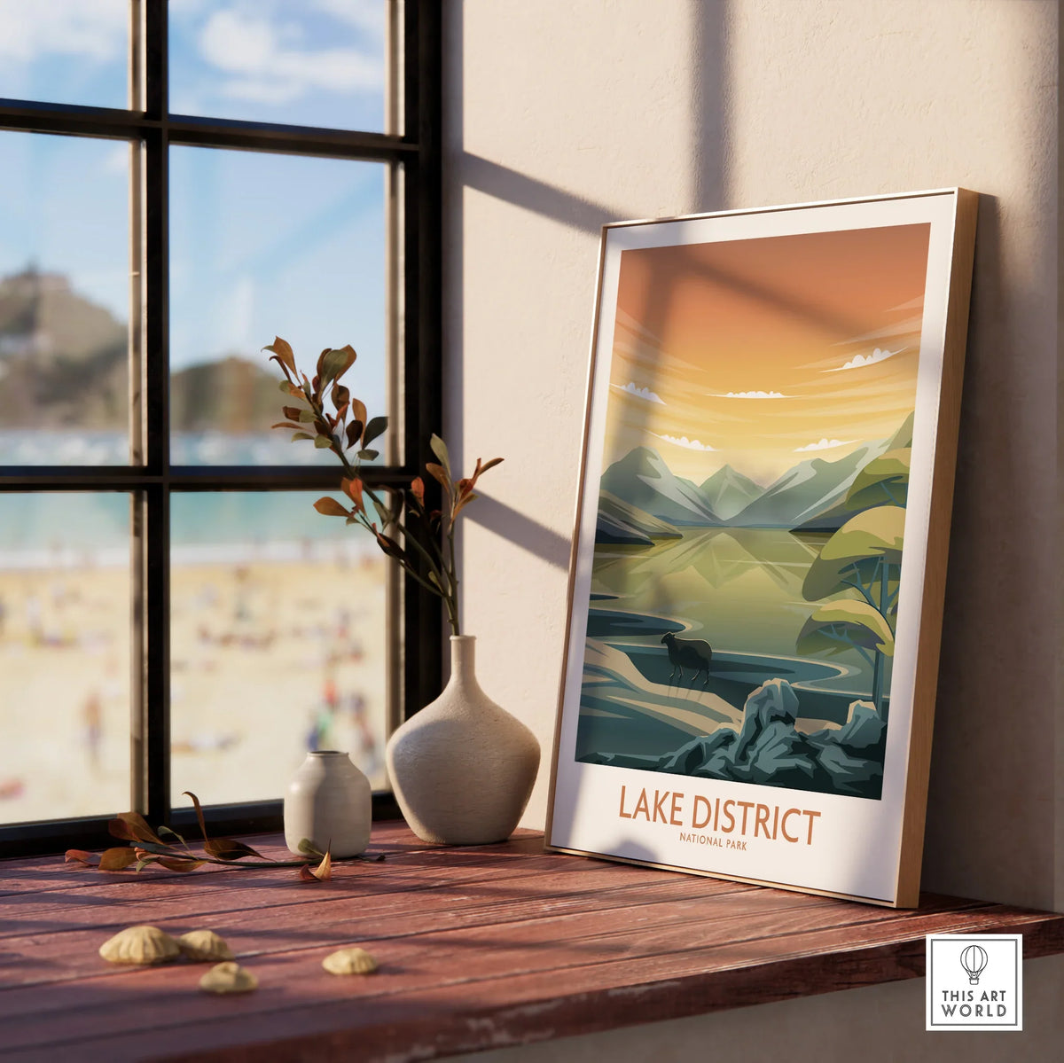 Lake District National Park framed travel poster on windowsill with natural wood frame