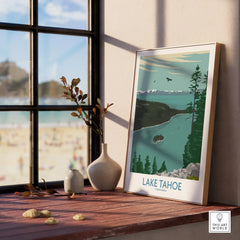 Framed Lake Tahoe California travel poster on a windowsill, with beach and decor vases.