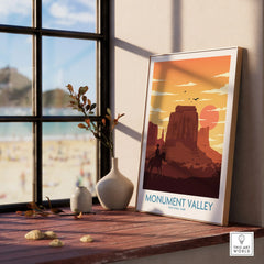 Framed Monument Valley National Park print on windowsill with natural wood frame and vases