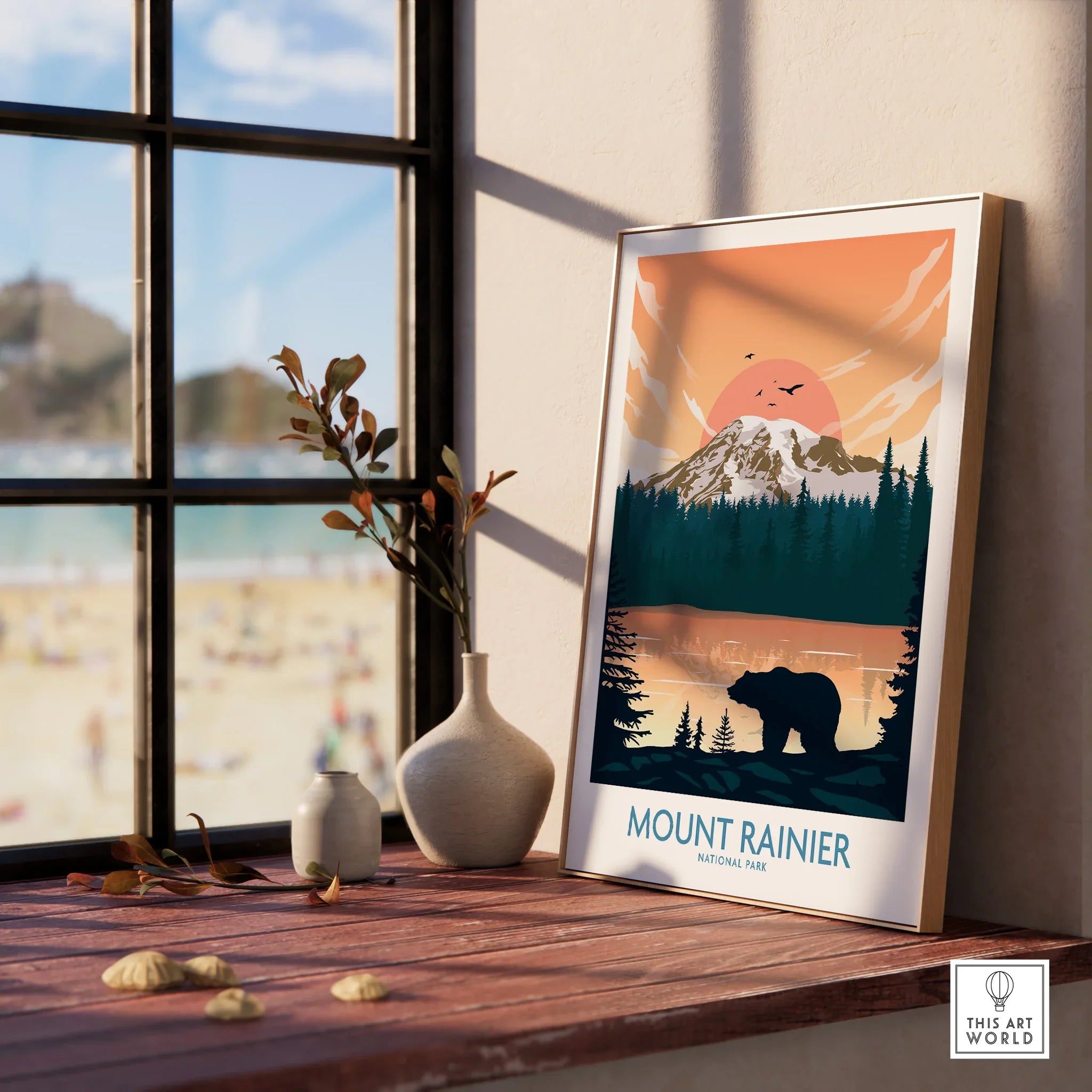 Framed Mount Rainier National Park travel poster with bear and mountain, window sunlight.