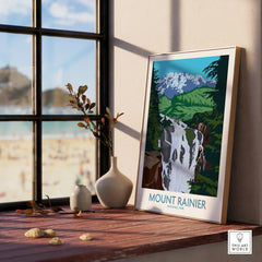 Framed Mount Rainier National Park art print on windowsill with vases and beach view