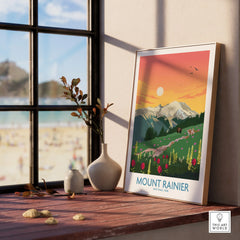 Framed Mount Rainier National Park print with wildflowers and sunrise, on window ledge