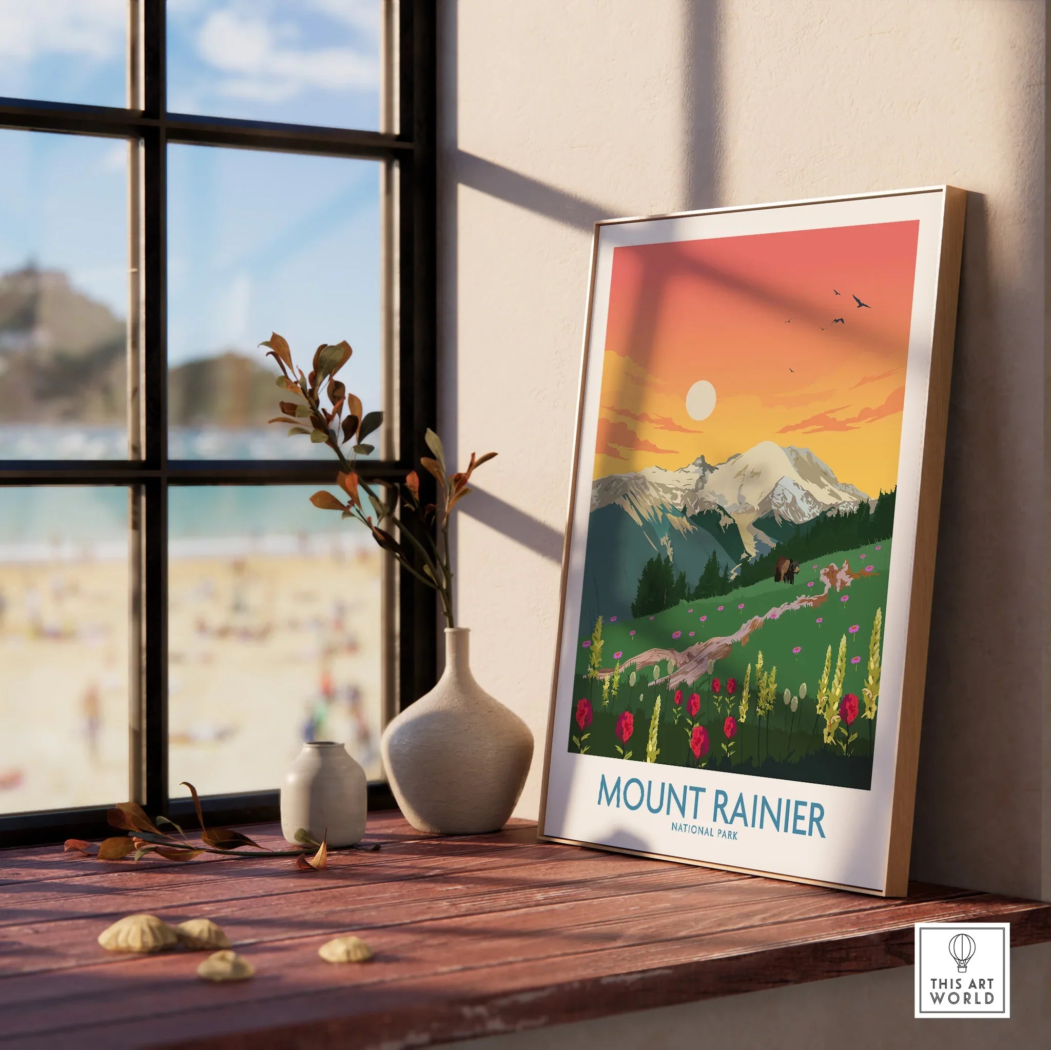 Framed Mount Rainier National Park print with wildflowers and sunrise, on window ledge