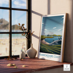 Framed Pembrokeshire Coast National Park travel poster on a window sill with natural light