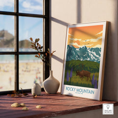 Framed Rocky Mountain National Park art print with elk, mountains, and sunset on a window sill.