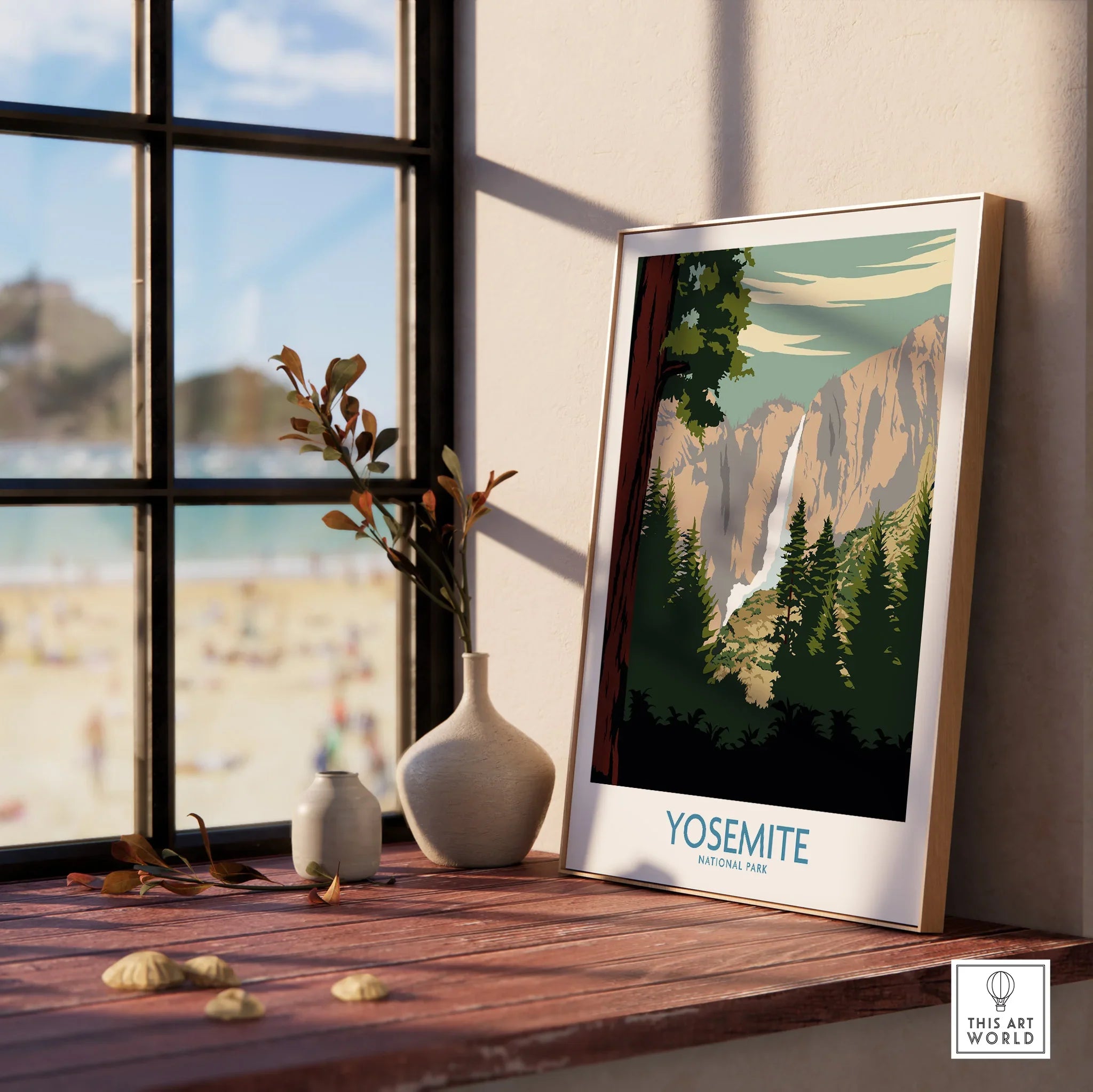 Yosemite National Park print in natural wood frame on windowsill with vases and outdoor view