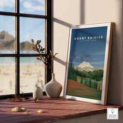 Framed Mount Rainier National Park travel poster on rustic windowsill with vases, sunlight