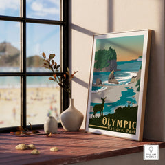 Framed Olympic National Park travel poster on windowsill with coastal landscape art