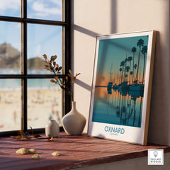 Oxnard California Poster | Scenic Pacific Marina Canvas Print displayed on a sunny windowsill with a beach view.