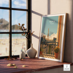 Framed Paris travel poster on windowsill with vases and beach view outside window