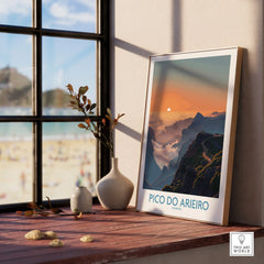 Framed Pico do Arieiro travel print on window sill with beach view and vases, wall art decor.
