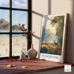Framed Richmond Park art print with deer, on window sill with vases, natural light