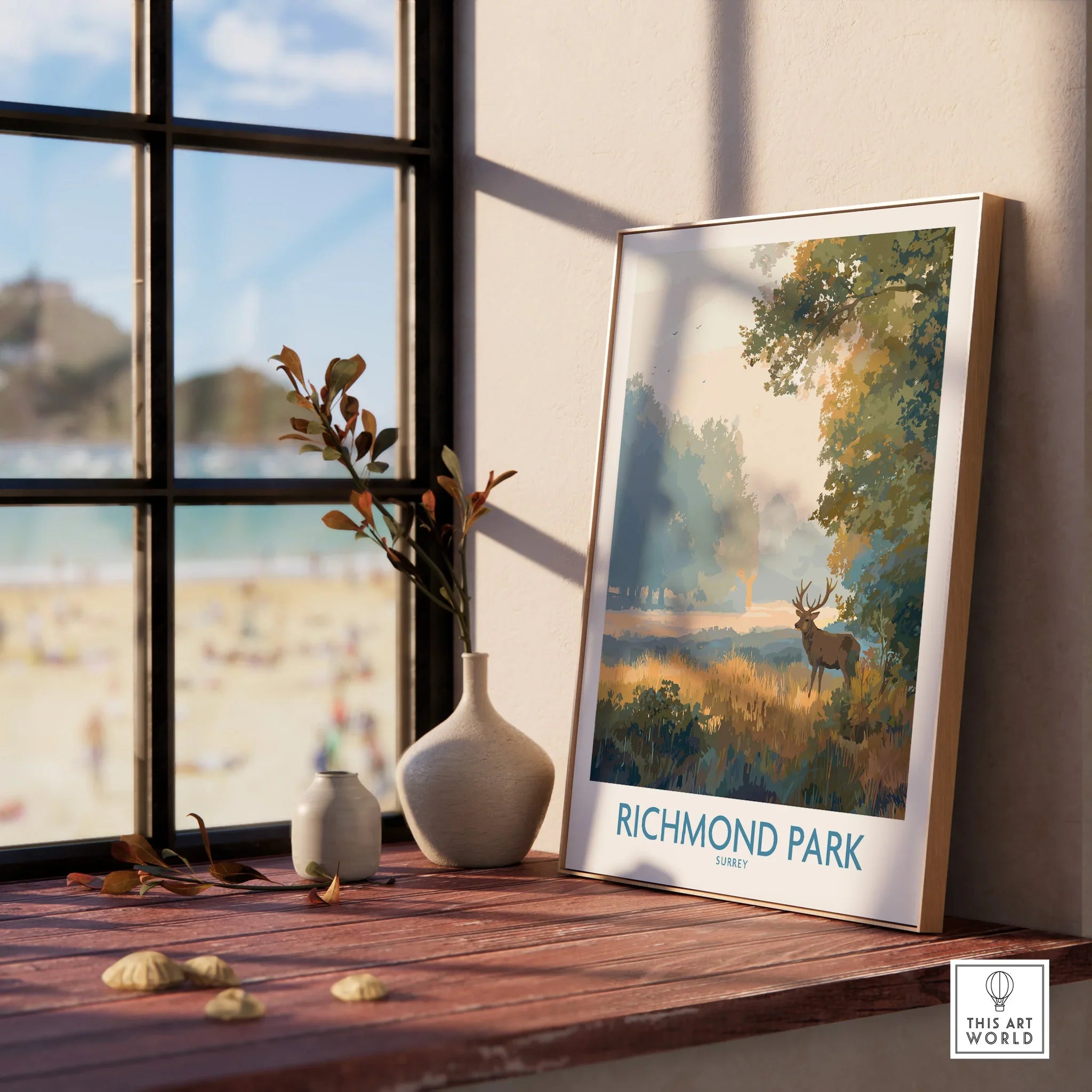 Framed Richmond Park art print with deer, on window sill with vases, natural light