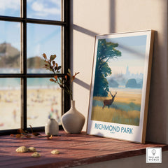 Richmond Park art print with deer in natural wood frame on sunny window ledge, vase decor nearby.