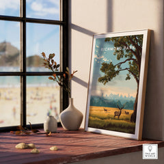 Framed Richmond Park travel poster with deer and city skyline, on window sill with vases