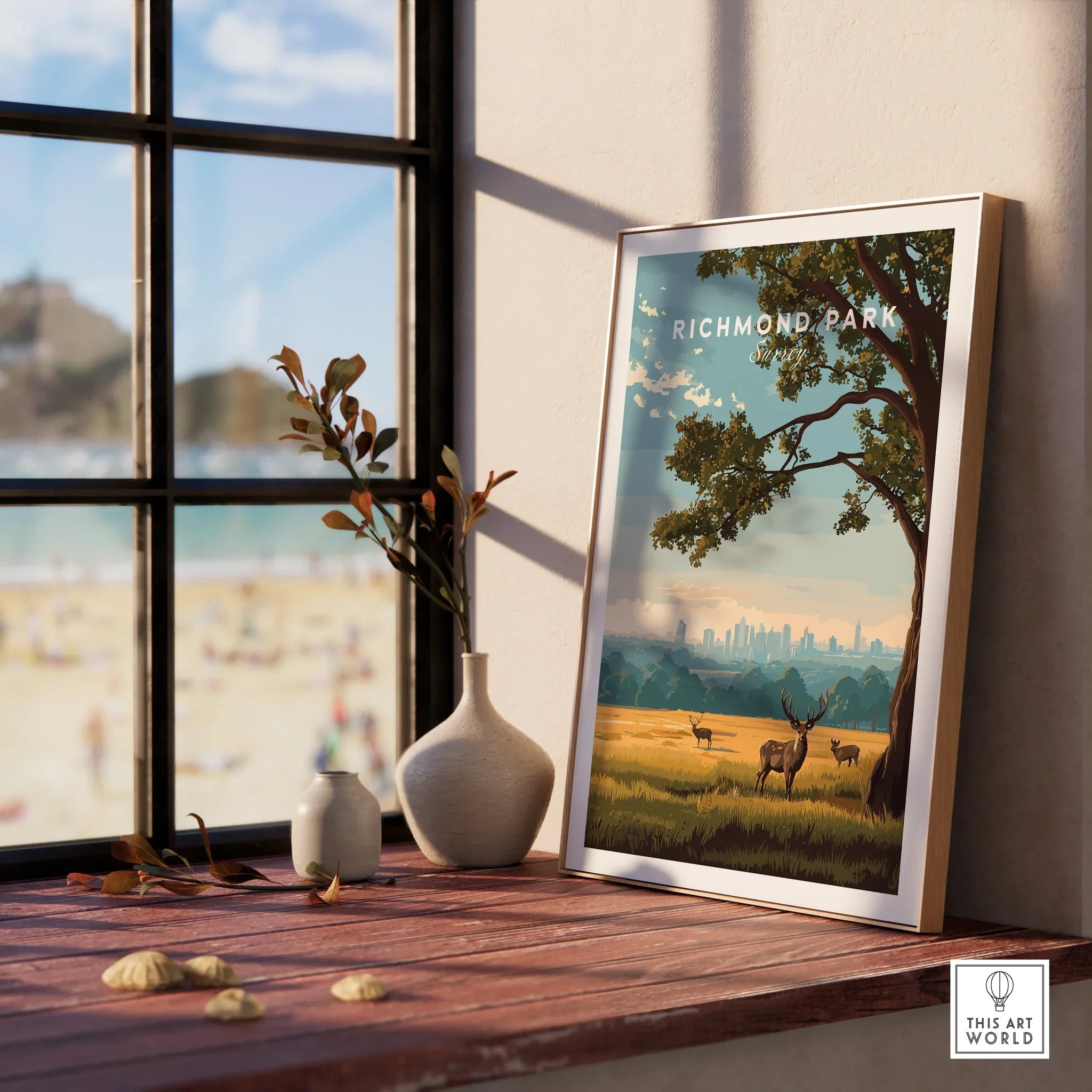 Framed Richmond Park travel poster with deer and city skyline, on window sill with vases