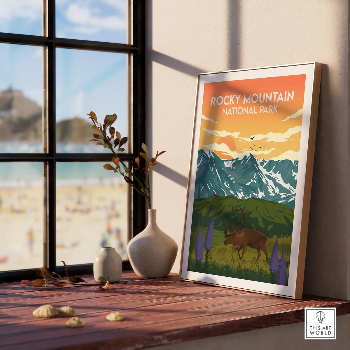 Framed Rocky Mountain National Park print on windowsill with vases and beach view