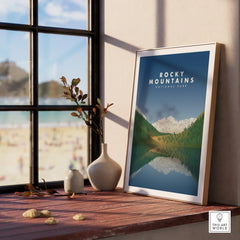 Framed Rocky Mountains National Park art print on windowsill with decorative vases
