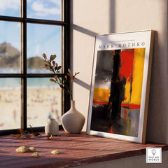 Mark Rothko Style Bold Black and Yellow Abstract Canvas Art Print displayed on a wooden table by a window.