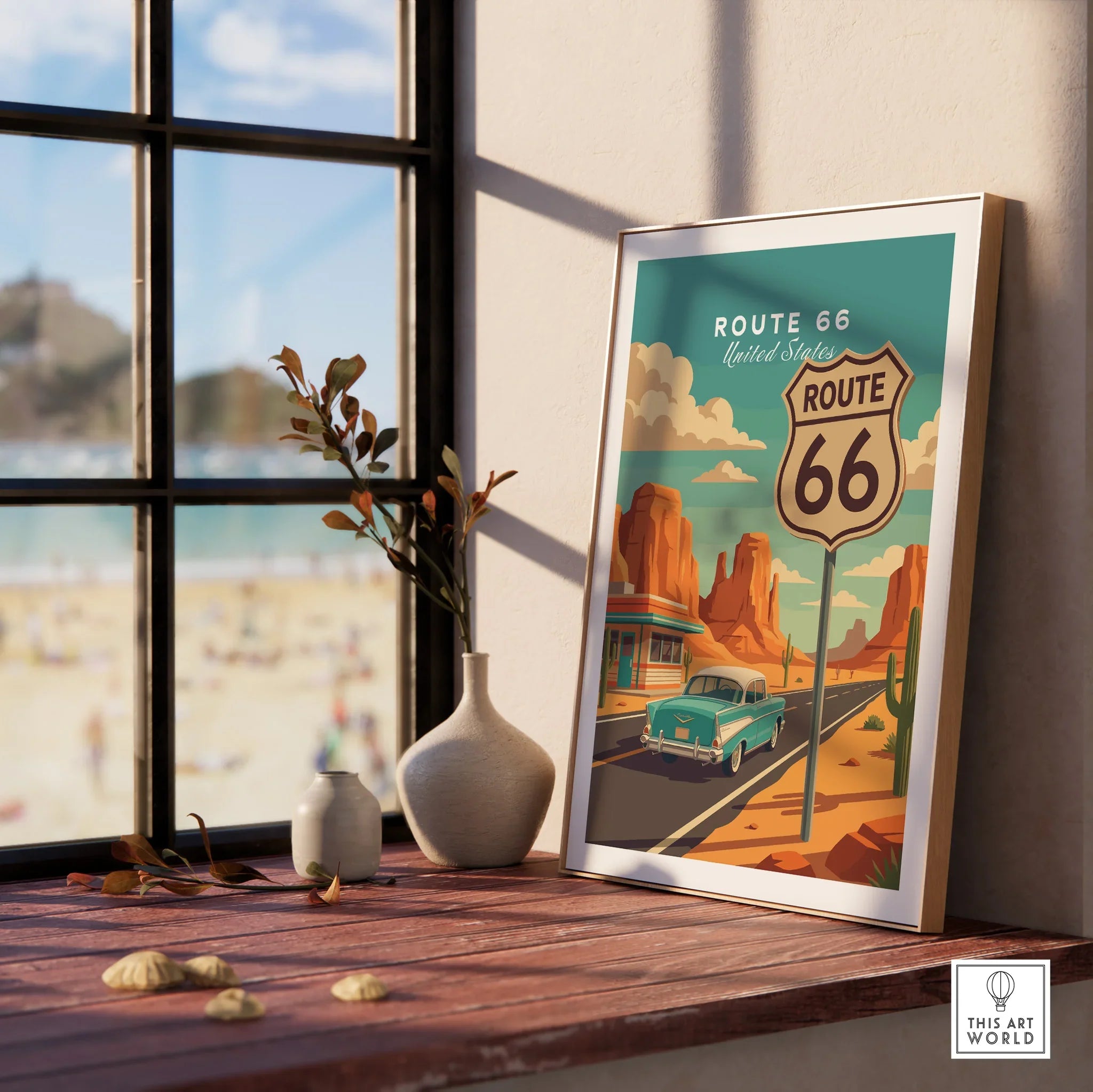 Framed Route 66 travel poster with vintage car, displayed on a wooden windowsill with vases.