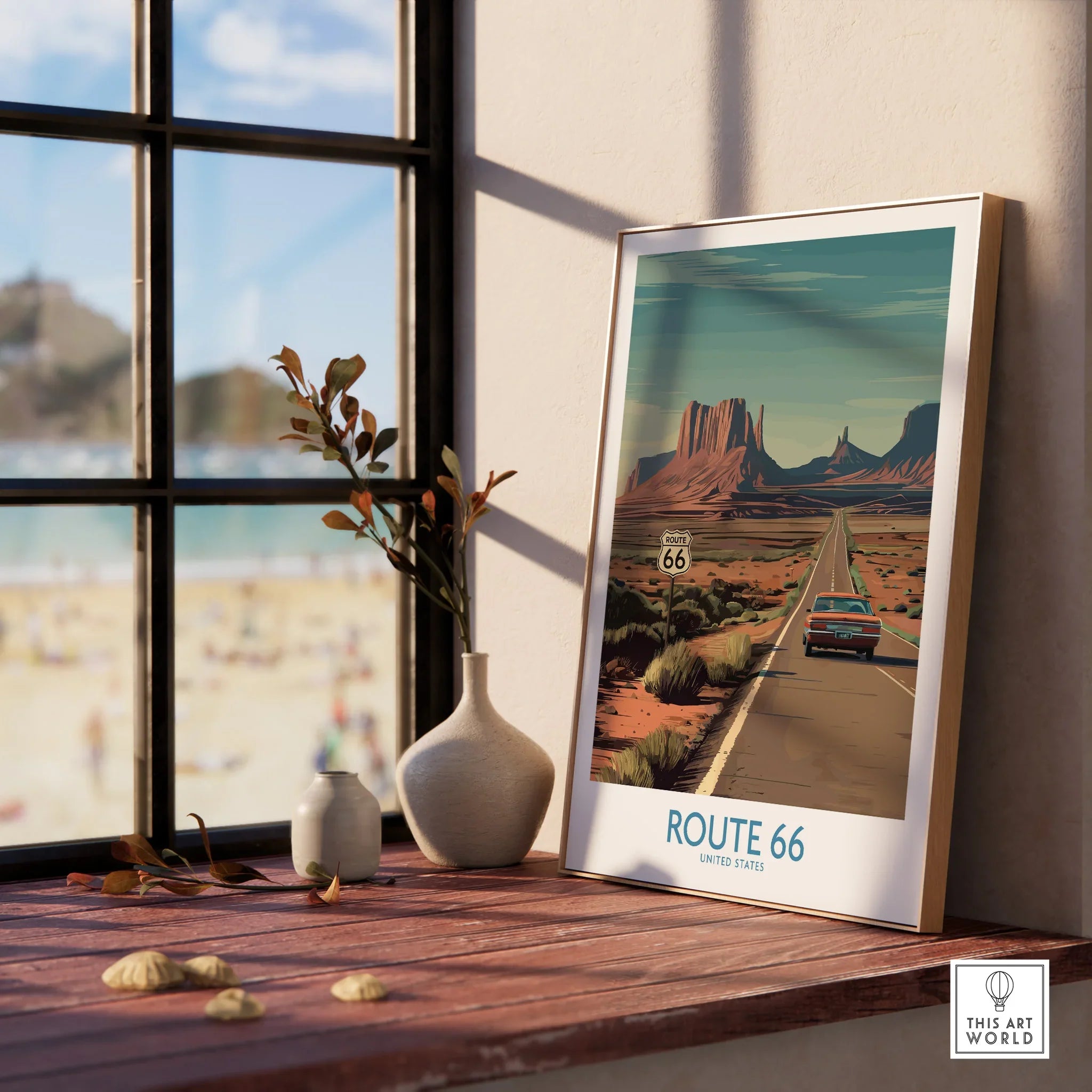 Framed Route 66 travel poster with a desert highway scene on a wooden windowsill, home decor.
