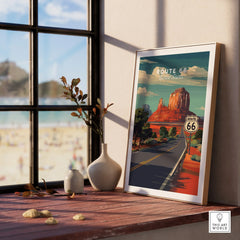 Framed Route 66 travel poster on windowsill with decorative vases and scenic window view