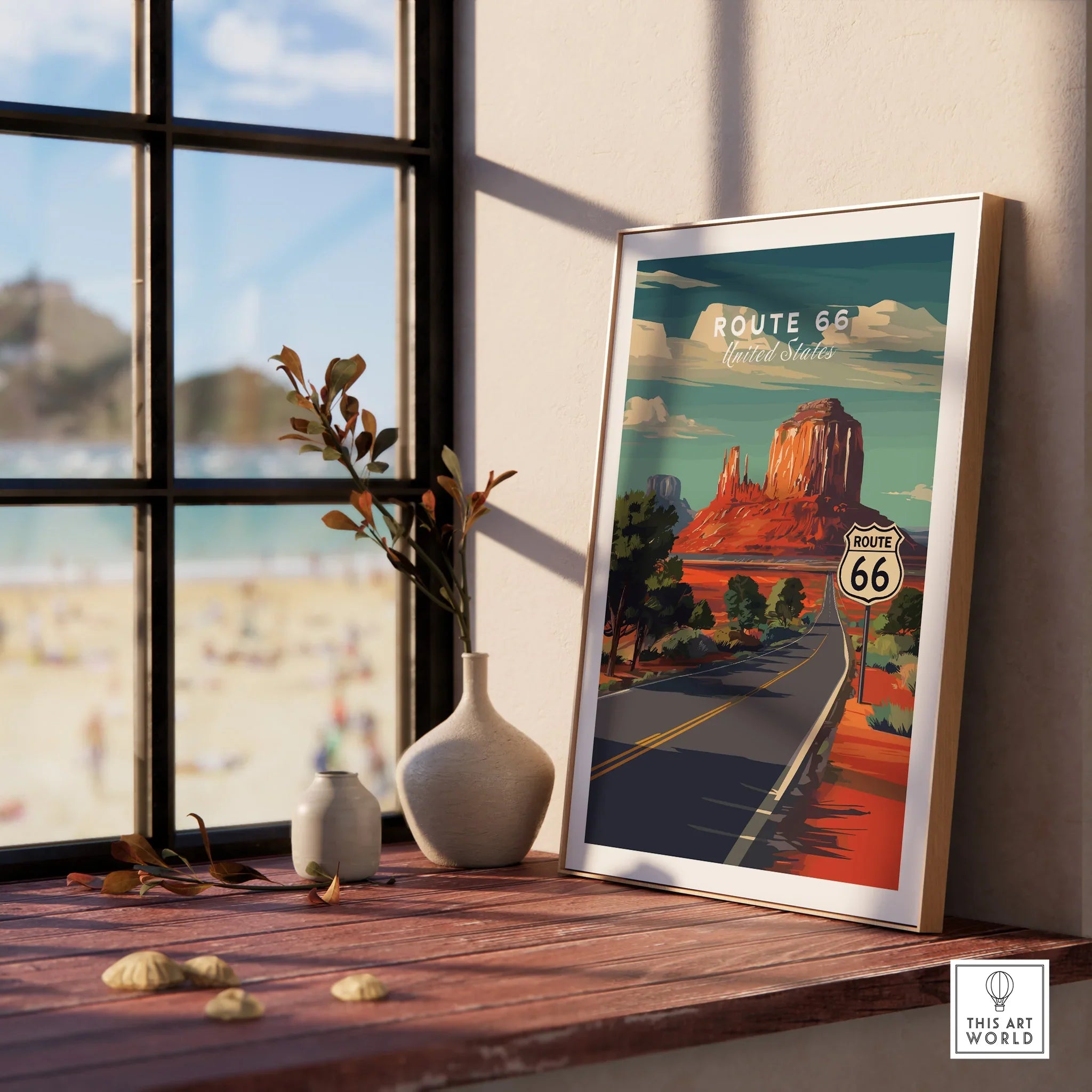Framed Route 66 travel poster on windowsill with decorative vases and scenic window view