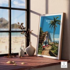 Santana Madeira travel art print in natural wood frame on window sill, beach view outside