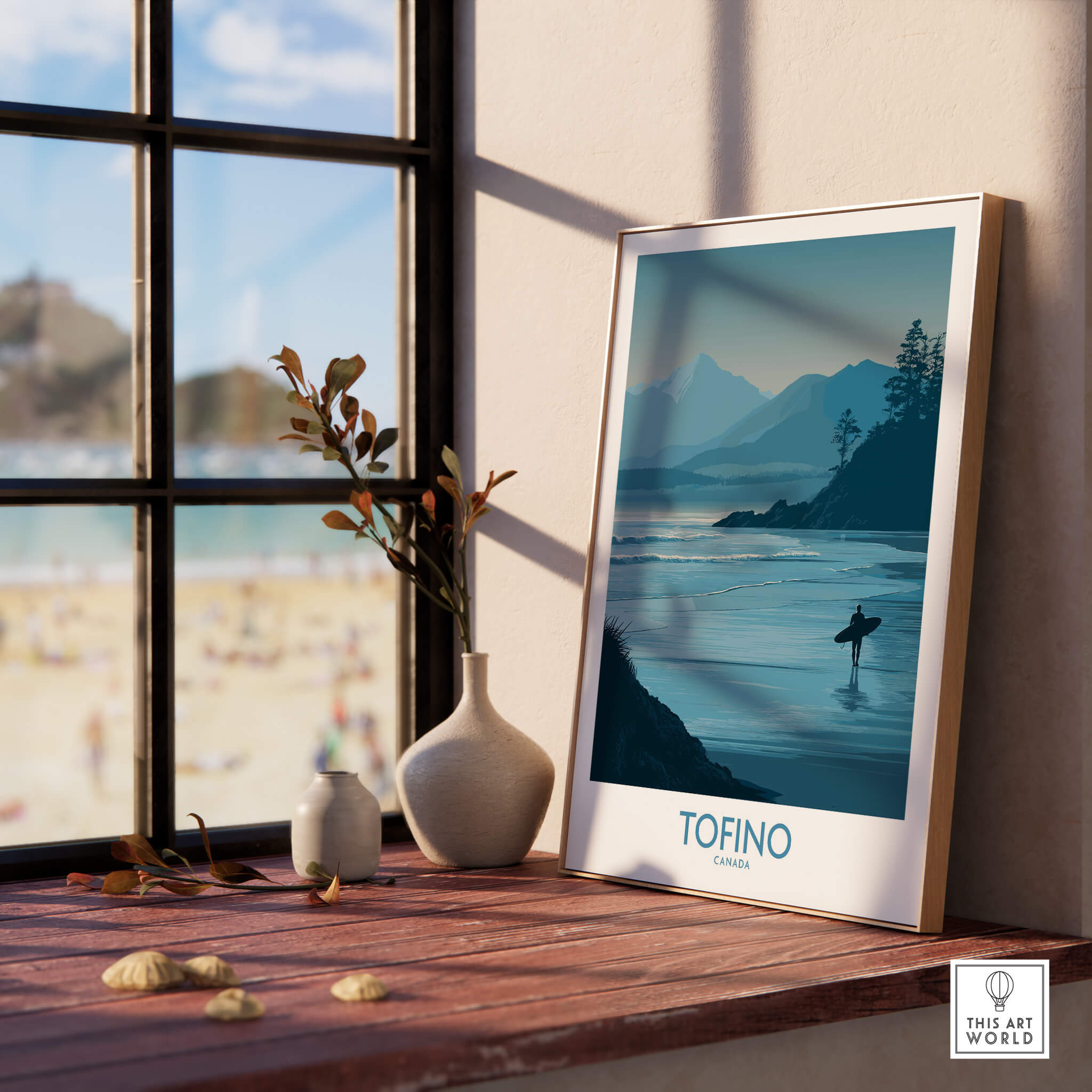 Tofino Canada Canvas Print | Misty Mountain & Shoreline Poster displayed indoors near a window with a beach view.
