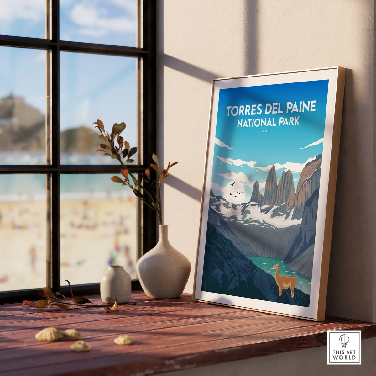 Torres del Paine National Park framed travel print on windowsill with scenic decor.