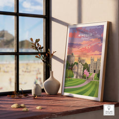 Framed Windsor England travel poster on windowsill with sunrise colors and nature decor