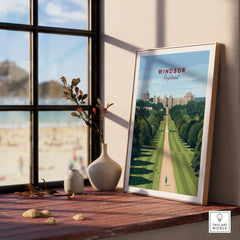 Windsor England travel poster in natural wood frame on windowsill with vases, beach view outside