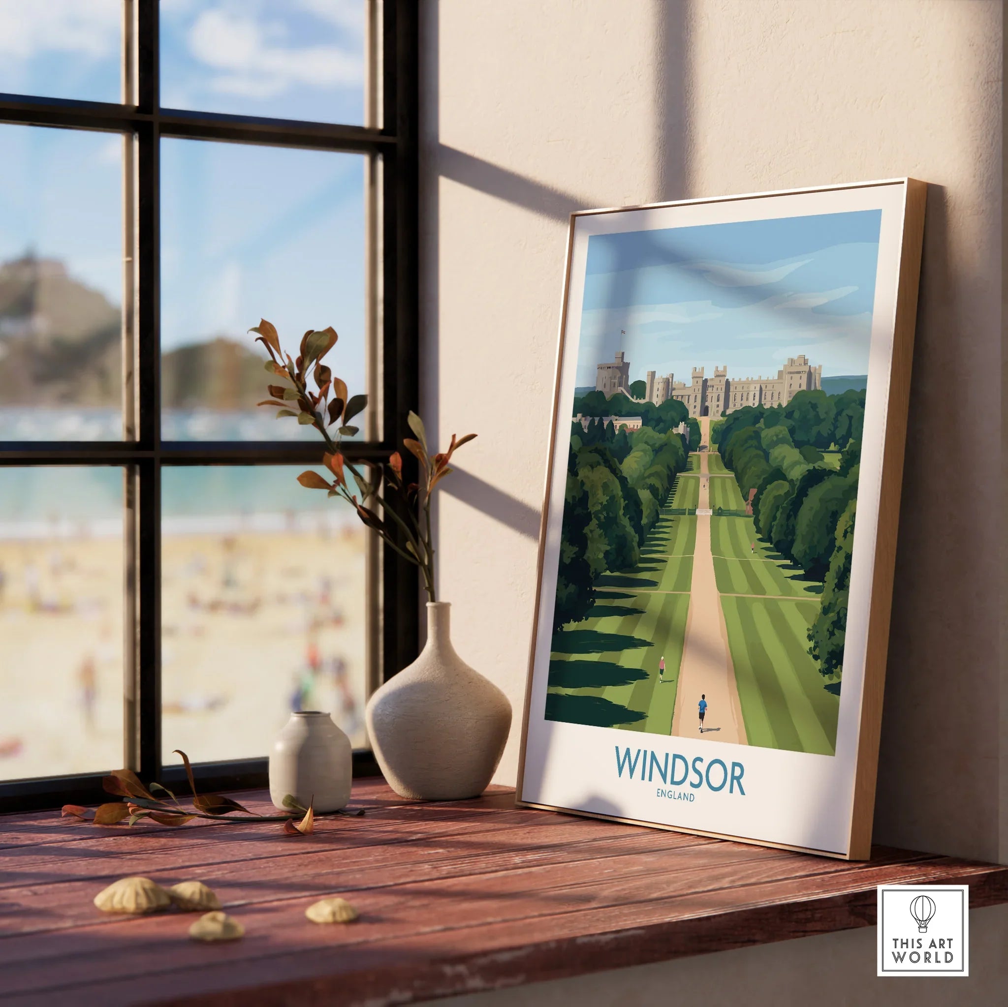 Framed Windsor England travel poster on wooden windowsill with vases and scenic view outside.