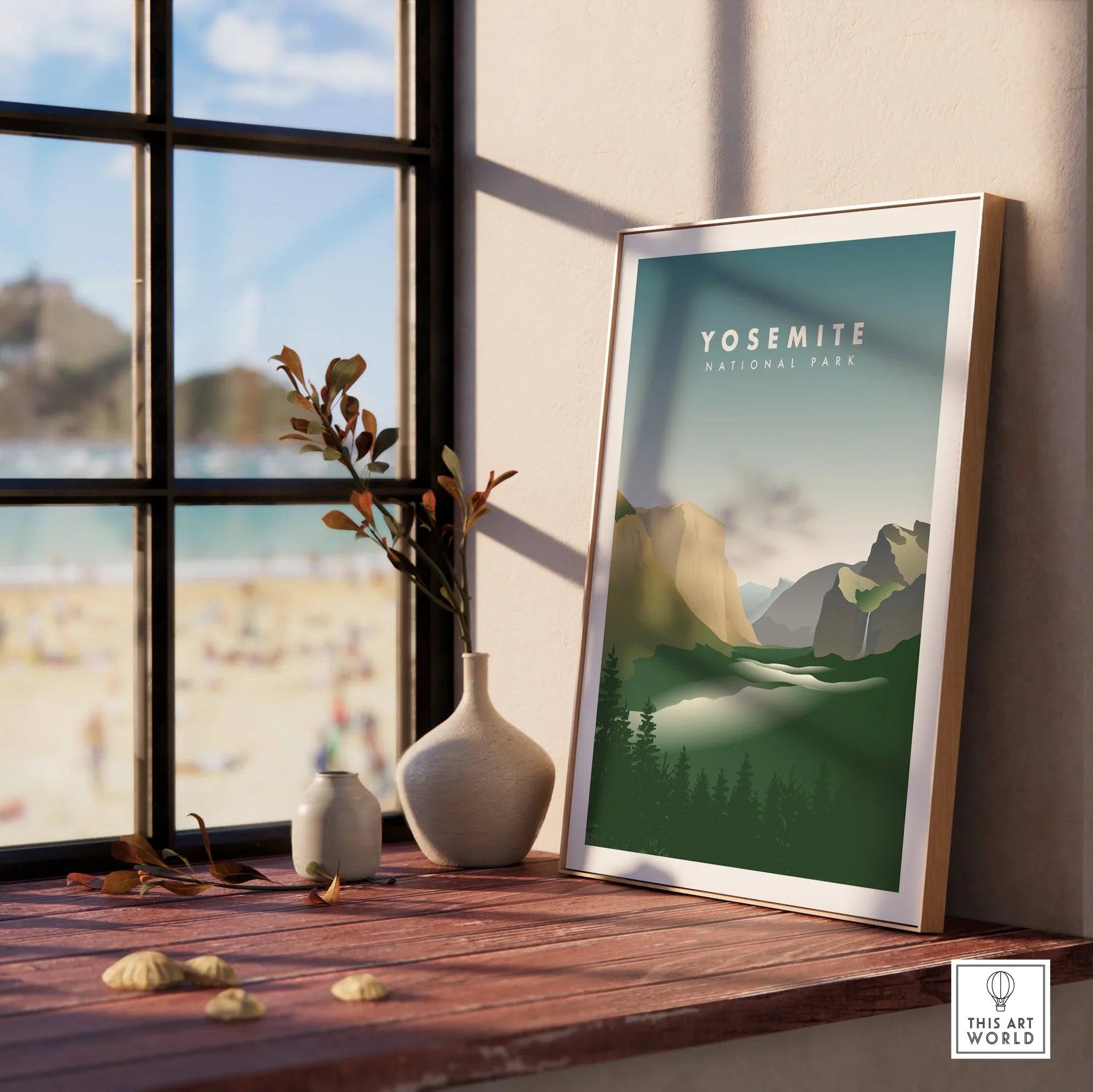 Framed Yosemite National Park travel print on a wooden windowsill with vase decor.