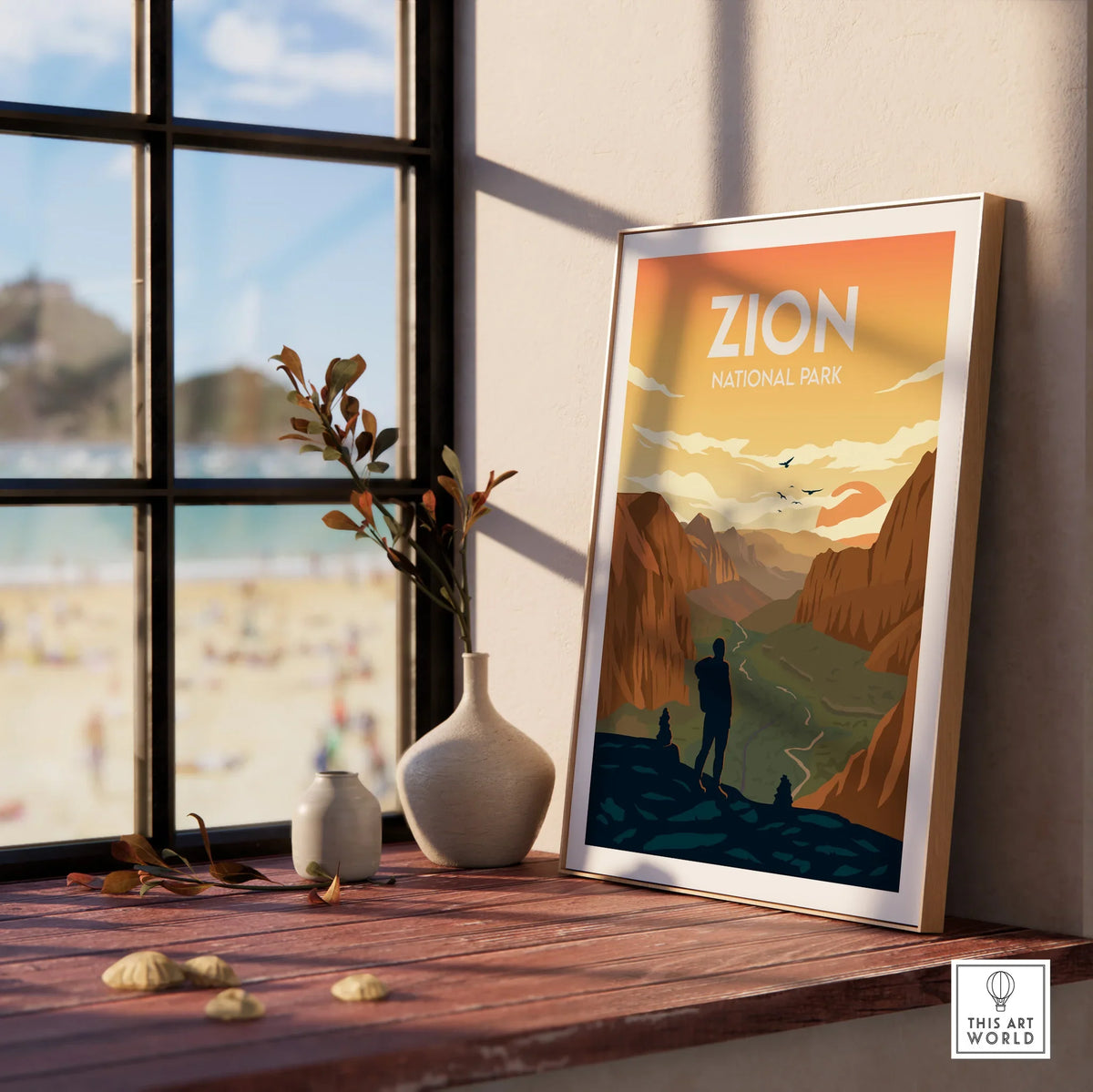 Framed Zion National Park print on windowsill with decorative vases and mountain landscape art