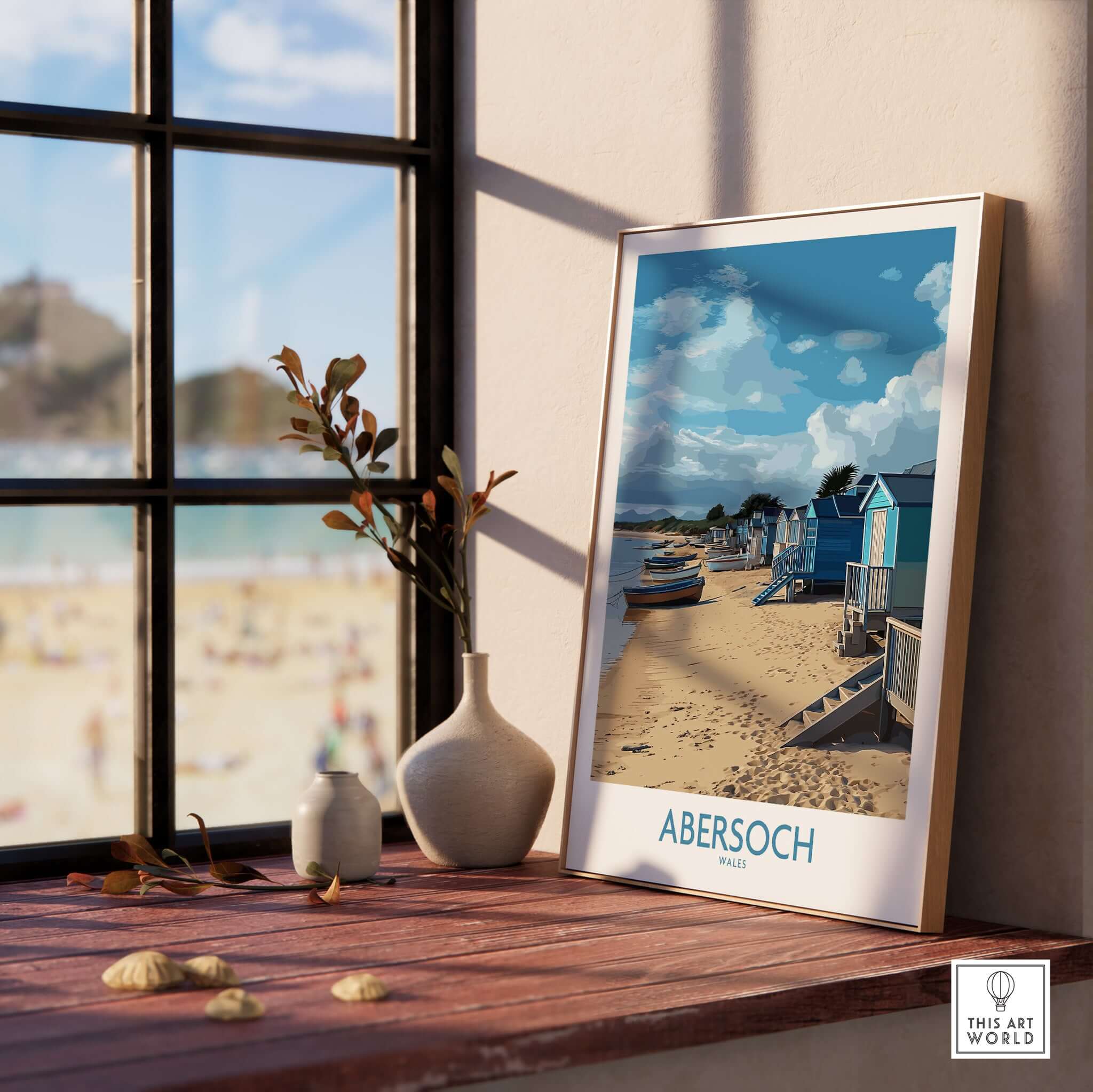 Abersoch Wales Beach Huts Art Print | Coastal Boats Wall Decor Poster displayed in a cozy indoor setting with a beach view.