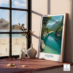Albania Canvas Print | Framed and Unframed Travel Wall Decor displayed by a window with a scenic river and mountains.