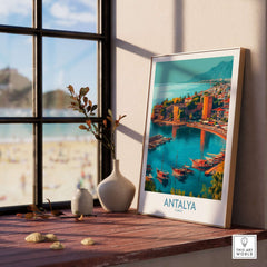 Antalya Turkey Kaleci Port Art Print | Historic Red Tower Poster displayed on a window sill with scenic background.